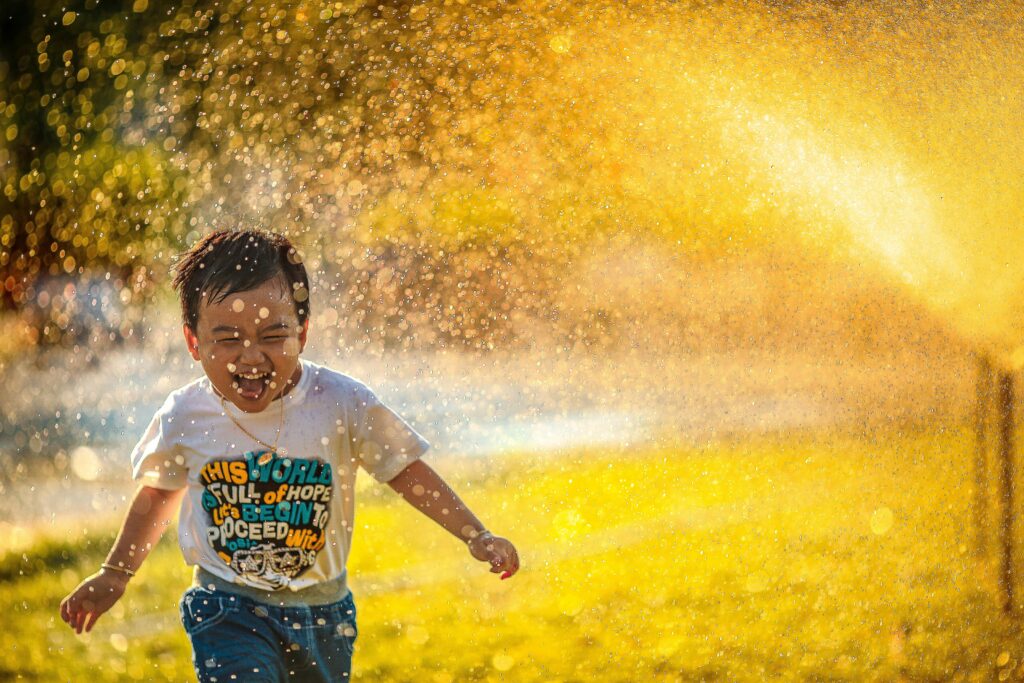 "Child running outdoors - movement helps regulate overstimulated child's nervous system"